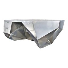 a metal object that looks like it is made out of steel and has geometric shapes