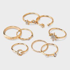 Eight-piece ring set from Wild Fable™ in gold-tone with clear crystal accents and varying celestial-themed designs. Includes star, moon, band rings and more. Great for pairing with your favorite necklaces and/or earrings. If you’re not satisfied with any Target Owned Brand item, return it within one year with a receipt for an exchange or a refund. Wild Fable™: A look for every story. Multi Ring, Gold Rings Stackable, Ring Trends, Moon Ring, Butterfly Ring, Textured Ring, Star Moon, Cubic Zirconia Rings, Wild Fable