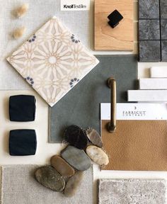 various materials are arranged on the floor in this display with wood, tile and other items