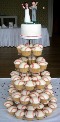 a wedding cake made out of cupcakes and topped with a baseball on top