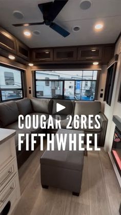 the interior of a motor home with couches and windows