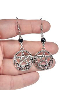 "Silver Pentacle Earrings with Obsidian Beads, Black Gemstone Wiccan Jewelry with Sterling Silver or Stainless Steel Ear Wires This listing is for one set of these lovely silver-plated Celtic pentacle charm earrings with genuine 6mm black obsidian beads. Each necklace comes in its own gift box! (if multiple pendants are ordered without chain, they may be packed together in one gift box) Ear Wire options are: Stainless Steel: Hypoallergenic and tarnish resistant! Sterling Silver: Hypoallergenic O Witchy Products, Pentacle Earrings, Pentagram Pendant, Wiccan Jewelry, Obsidian Stone, Pagan Jewelry, Protection Necklace, Green Peridot, Black Obsidian