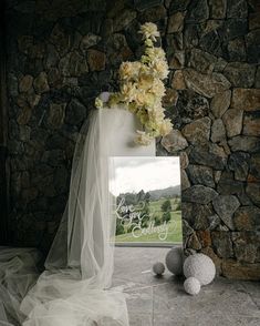 there is a vase with flowers in it next to a sign that says happy birthday