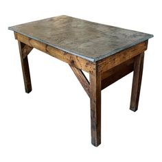 an old wooden table with metal top and legs on a white background for use as a coffee table or dining room table