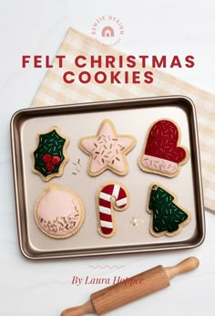 a cookie tin filled with christmas cookies on top of a table