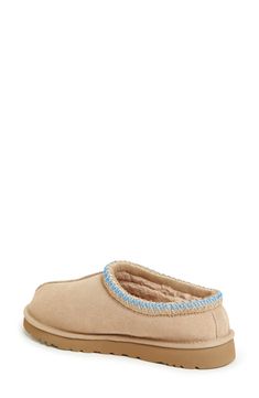 A top-quality suede upper is shaped over a light, flexible EVA sole and plush lining for comfortable indoor and outdoor wear. Slight dye transfer may occur with darker colors during first few wears Leather upper/genuine shearling or UGGpure-wool lining/EVA sole Shearling may be sourced from Australia, Ireland, Spain, the UK or the USA. See packaging for confirmed country of origin Imported Ugg Tasman Slippers, Preppy Shoes, Ugg Tasman, Xmas List, Cute Preppy Outfits, Birthday Wishlist, Summer Fits, Eva Sole, Dream Shoes