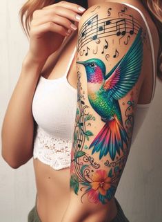 a woman with a colorful hummingbird tattoo on her right arm and shoulder, next to music notes