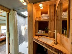 a bathroom with a sink, mirror and bathtub inside of it next to a shower