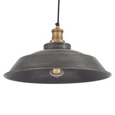 an industrial style pendant light with a black metal finish and gold accents on the bulb