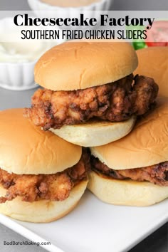 three chicken sliders stacked on top of each other