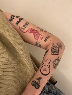 a woman with many tattoos on her arm