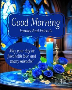 blue roses and candles on a table with a sign that says good morning family and friends