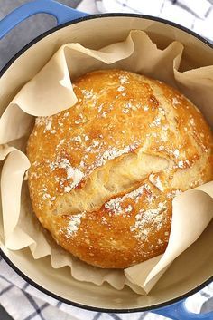 a loaf of bread in a blue pot