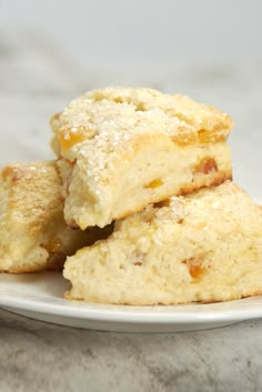 three biscuits stacked on top of each other on a white plate