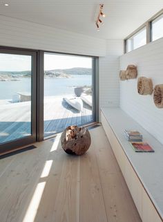 a living room filled with furniture next to a large sliding glass door that opens onto a deck