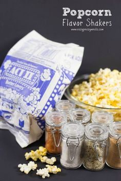 popcorn flavored flavors in small glass jars next to a bag of popcorn flakes