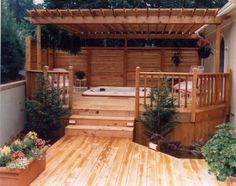 a hot tub sitting on top of a wooden deck