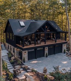 this is an aerial view of a house in the woods with stone steps leading up to it