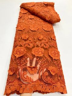 an orange lace with hand on it