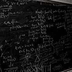 a blackboard with many calculations written on it