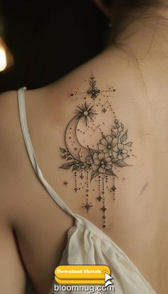 the back of a woman's shoulder with flowers and stars tattoo on her left side