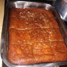 a pan filled with food sitting on top of a stove