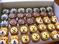 there are many cupcakes in the box with faces on them and zebra's noses