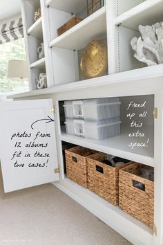 a white bookcase with baskets and labels on it