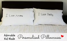 two pillows that say i love my daddy and adorable personalized pillowcases on a bed