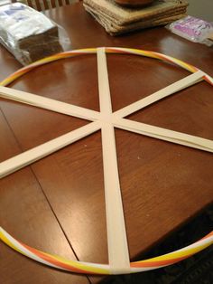 a close up of a wooden table with a circular object on it