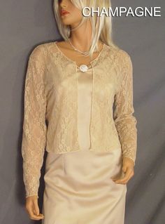 Comfortable and chic! Hip length Lace long sleeve bolero wedding jacket shrug. Perfect for anyone looking for a little extra coverage. Made From 40% Nylon & 60% Soft Rayon Lace Fabric To Give It A Nice Drape & The Stretchability To Last! Newly made in each size and ready to ship. VIEW PICTURES FOR SIZE AND MEASUREMENT CHART If you are needing more then four of this item just let us know. We are happy to offer VOLUME DISCOUNTS We keep several in each size in stock so that we can ship all Elegant Party Shrug For Fall, Elegant Fall Party Shrug, Long Sleeve Evening Dress For Mother Of The Bride, Elegant Long Sleeve Mother Of The Bride Dress, Formal Long Sleeve Shrug For Fall, Spring Long Sleeve Formal Mother Of The Bride Dress, Formal Spring Long Sleeve Shrug, Spring Formal Long Sleeve Mother Of The Bride Dress, Elegant Long Sleeve Stretch Shrug