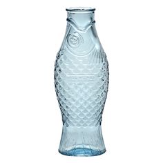 a clear glass vase with fish design on the top and bottom, sitting in front of a white background