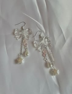 handmade, coquette themed earrings, by me! made with glass beads, chain, and plastic beads.  good for any occasion! if sold out, you can dm me on instagram at kefsbeads to order one! Cute Pearl Earrings, Earring With Beads, Jewelleries Aesthetic, Cute Earrings Handmade, Earings Beads Ideas, Aesthetic Beaded Earrings, Fairy Core Earrings, Glass Beads Earrings, Cute Beaded Earrings For Party