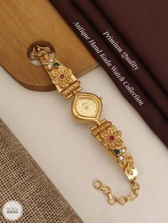 Description :- Womens Watch, Gold Personalized Watch, Engraved Watch, Gift for Her, Womens Gift, Gift for Wife, Bridesmaid Watch, Watches for Women Gift yourself a royal look with this perfectly crafted kundan necklace set from Manalisstudio. Crafted with high quality, it is impressive in design. The green enamel artwork adds perfect texture to the design. Perfect for weddings and festivities, this antique necklace set should be put on with your favorite sari or lehenga. 100% Satisfaction. Long Yellow Gold Watch With Rectangular Dial For Gift, Yellow Gold Watch With Rectangular Dial As Gift, Luxury Jewelry And Watches With Round Dial For Wedding, Luxury Wedding Jewelry And Watches With Round Dial, Silver Watches With Rectangular Dial For Wedding, Silver Rectangular Dial Watches For Wedding, Elegant Analog Watches For Wedding, Anniversary Jewelry And Watches With Metal Rectangular Dial, Gift Jewelry With Diamond Hour Markers And Round Dial