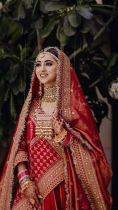 Our eyes are stuck on that one-of-a-kind gold necklace😍 | Indian bridal outfits, Indian bride outfits, Indian bridal fashion Rajasthani Bride, Best Indian Wedding Dresses, Rajasthani Dress, Red Bridal Dress, Bridal Lehenga Designs, Latest Bridal Lehenga, Wedding Lehenga Designs