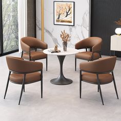 four chairs around a round table in a room with marble walls and flooring on the other side