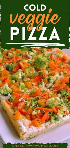 a close up of a pizza on a plate with broccoli and carrots