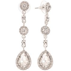 Your big day calls for the most elegant accessories! Drop Pendant Rhinestone Earrings feature silver colored metal with clear rhinestones in a a drop design with a mix of round and teardrop shapes. Pair them with a dignified updo and your dream dress to look like royalty on your wedding day!     Dimensions:   Length: 2 1/2"  Width: 1 5/8"      Package contains 1 pair of earrings. Elegant Silver Crystal Earrings With Rhinestones, Silver Teardrop Bling Earrings, Silver Crystal Earrings With Bling, Silver Sparkly Crystal Earrings, Glamorous Silver Teardrop Crystal Earrings, Dazzling Silver Crystal Earrings, Elegant Silver Crystal Earrings With Bling, Silver Crystal Chandelier Earrings With Sparkling Stones, Sparkling Silver Crystal Bridal Earrings