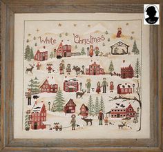 a cross stitch christmas scene with houses and trees