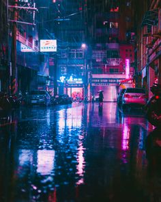 a city street at night in the rain