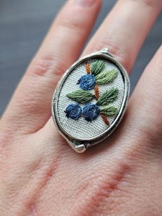 This vintage style adjustable ring would make a great gift or a perfect unique accessory for your outfit. Main Features: - Pendant was designed and hand embroidered by myself - miniature wild blueberries were embroidered using DMC thread on white cotton - oval pendant measures 1" x .75" - Ring is adjustable and is made of sterling silver Instagram Follow me @lemonsandthreadco for more embroidery content Contact: If you have any questions about this piece, please don't hesitate to contact me thro Blueberry Embroidery, Wild Blueberries, Embroidery On Clothes, Dmc Thread, Pretty Clothes, Oval Pendant, Vintage Ring, Accessories Unique, Adjustable Ring