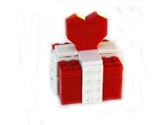 two red and white legos are stacked on top of each other, one with a bow