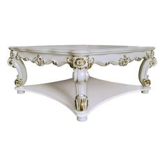 a white table with gold details on the top and bottom part, sitting against a white background