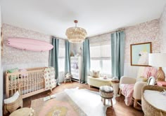 a baby's room is decorated in pastel colors