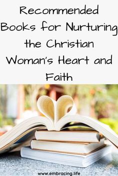 an open book with the title recommended books for nurturing the christian woman's heart and faith