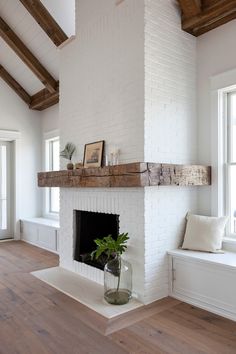 a white brick fireplace in a living room