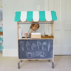 IKEA KITCHEN ICE CREAM SHOP HACK • U Ready, Teddy? Ikea Toy Kitchen Hack Cafe, Ice Cream Stand Diy, Awning Diy, Ikea Toy Kitchen, Ikea Play Kitchen Hack, Striped Awning, Ikea Play, Diy Lemonade Stand, Diy Lemonade