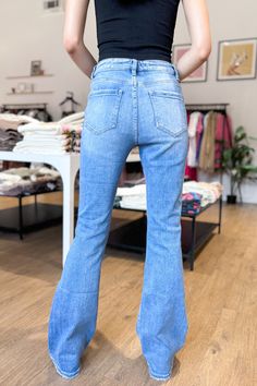 Elevate your style with these effortlessly cool, high rise flare jeans! Featuring a zipper fly and button closure, front and back pockets, and a subtle distressed finish at the bottom hem, these versatile jeans can be dressed up or down for any occasion. Made with a stretch material for ultimate comfort, these jeans also give off cool western vibes. 94% cotton, 4.5% polyester, and 1.5% spandex make for the perfect combination of comfort and style Model is 5'7" and wearing a size 26. High Rise Denim Flares For Fall, Denim Flare Jeans With Frayed Hem For Fall, Chic High Waist Medium Wash Flare Jeans, Chic Light Wash Denim Flare Jeans, Dark Wash Denim Flare Jeans With Frayed Hem, Trendy Dark Wash Cropped Leg Flare Jeans, High Rise Dark Wash Denim Flares, Trendy Dark Wash Cropped Flare Jeans, Chic Dark Wash Flare Cropped Jeans