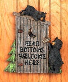 two bears are sitting in a birdhouse with the words bear bottoms welcome here on it