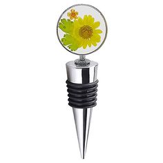 a wine bottle stopper with a yellow flower on it